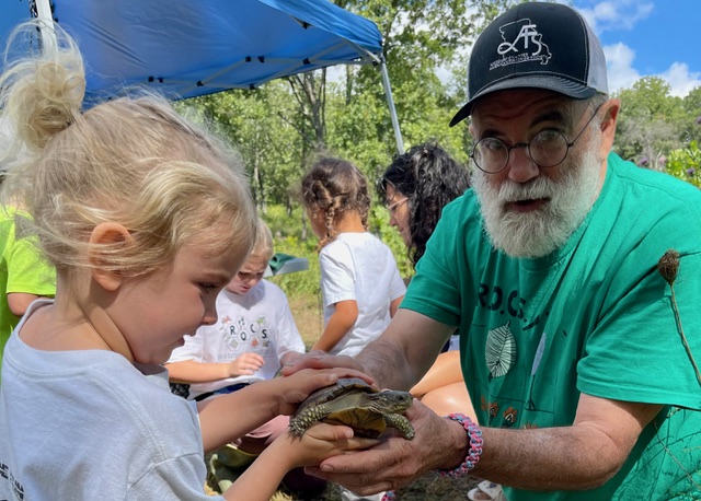 Turtle Booth - Youth holding a turtle